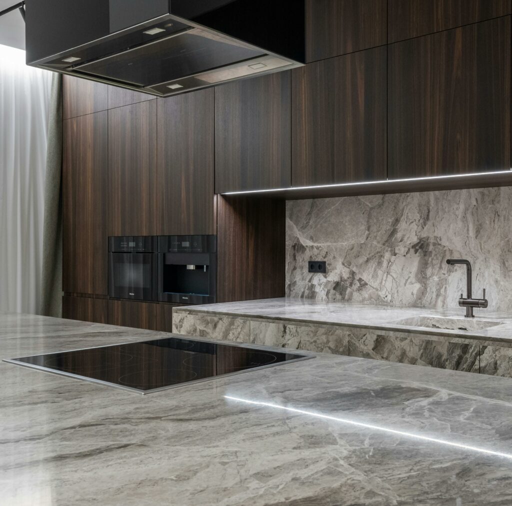 pexels-photo-6315804-6315804 Interior design of spacious stylish modern kitchen with induction stove and air extraction system with wooden cupboards