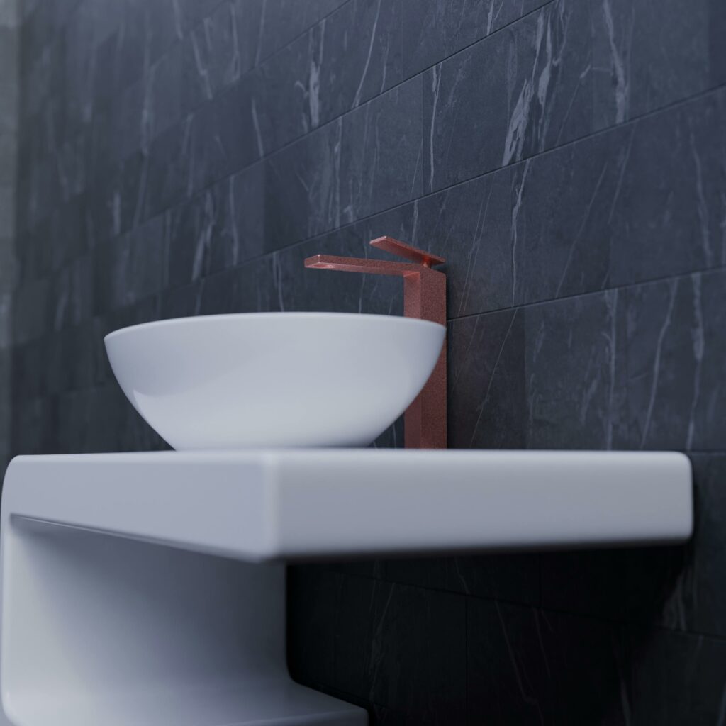 Elegant bathroom featuring a sleek white basin and marble tiles for a luxurious look.